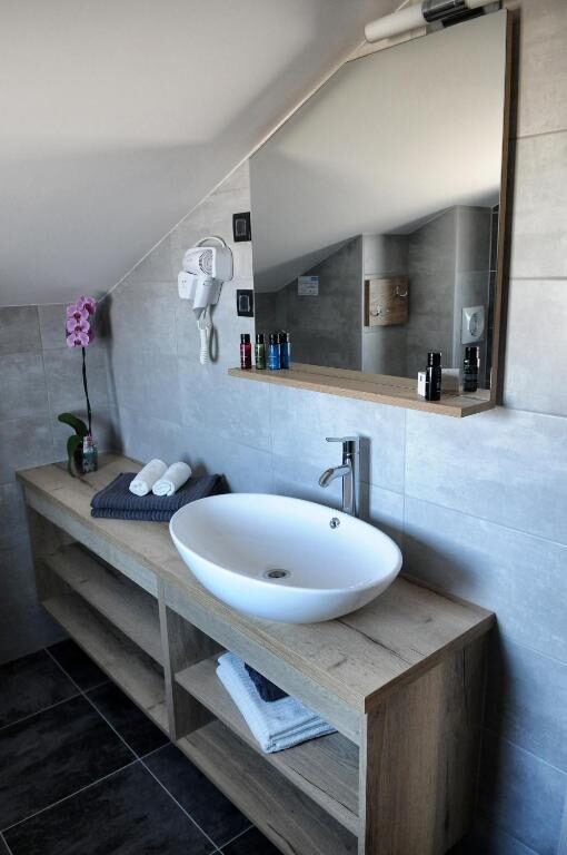 Bright private bathroom in a room at Azur